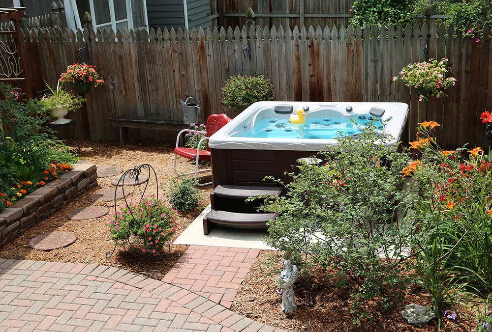 Hot tub with garden landscaping