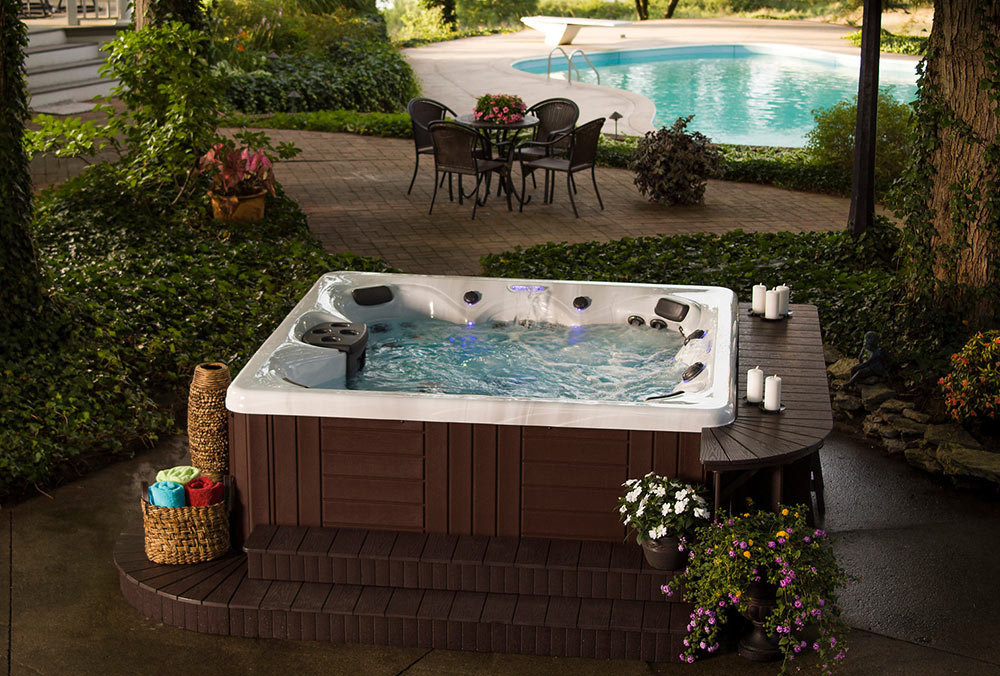 Outdoor hot tub on stamped concrete patio