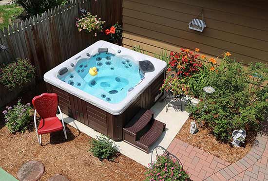 Overhead view of hot tub with garden landscaping